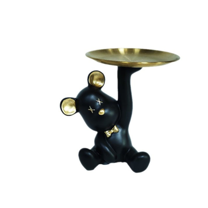Bear figurine holding a round tray