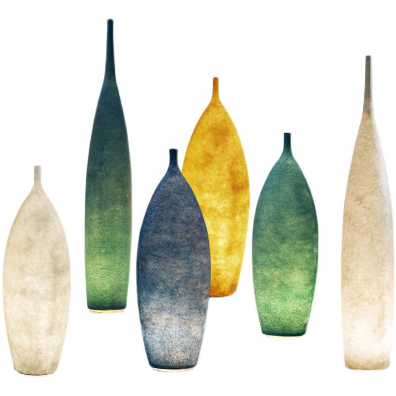 Floor lamp shaped like a bottle with textured surface