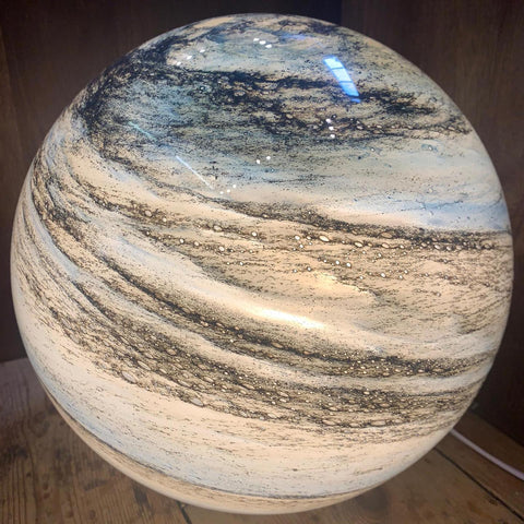Glass LED table lamp inspired by the moon with cosmic pattern
