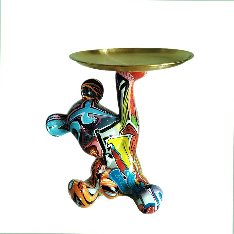 Bear figurine holding a round tray