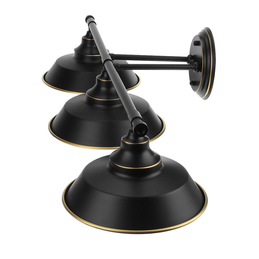 Black country-style wall sconce with three lights and glass shades