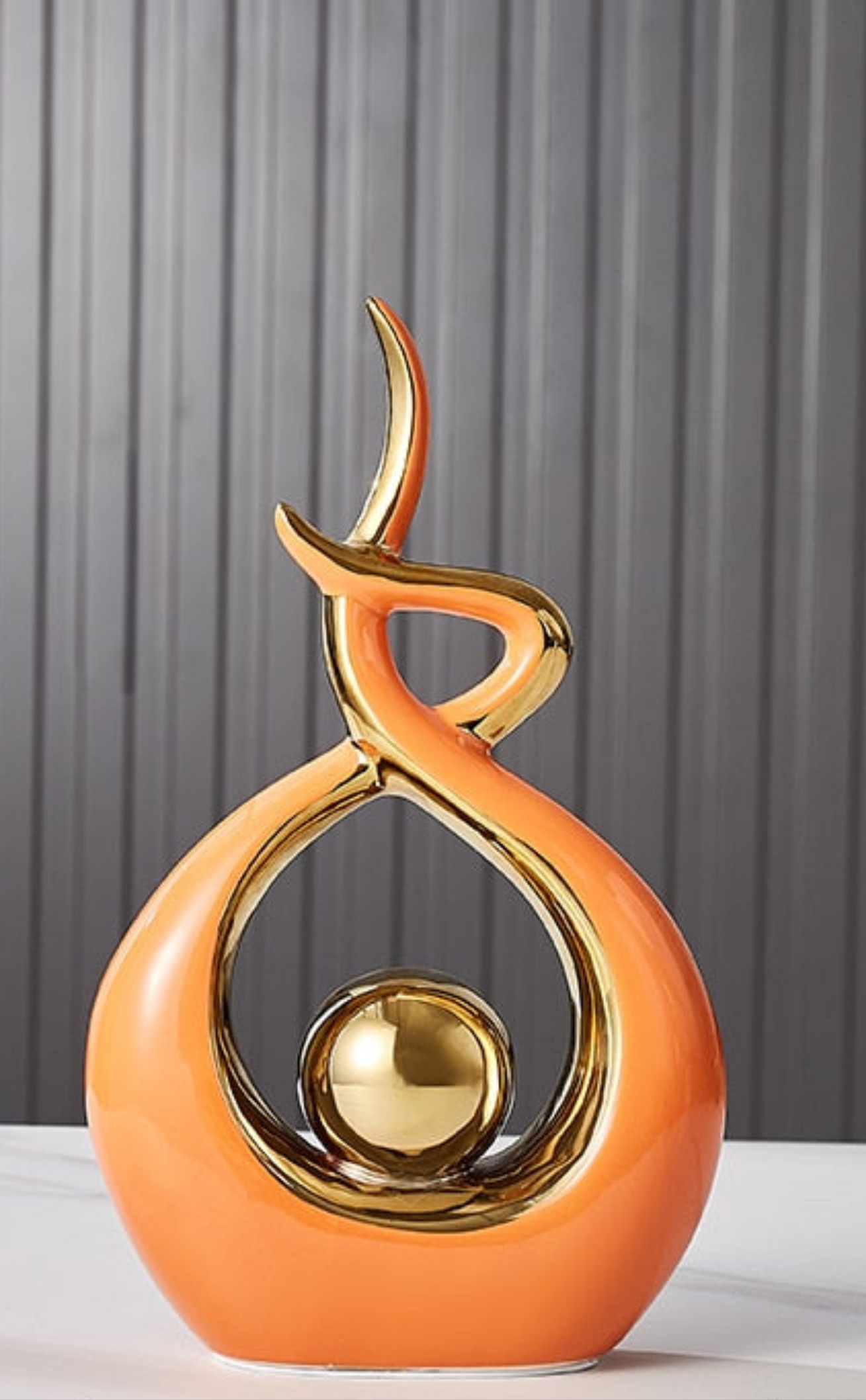 Ceramic abstract figurine with golden sphere