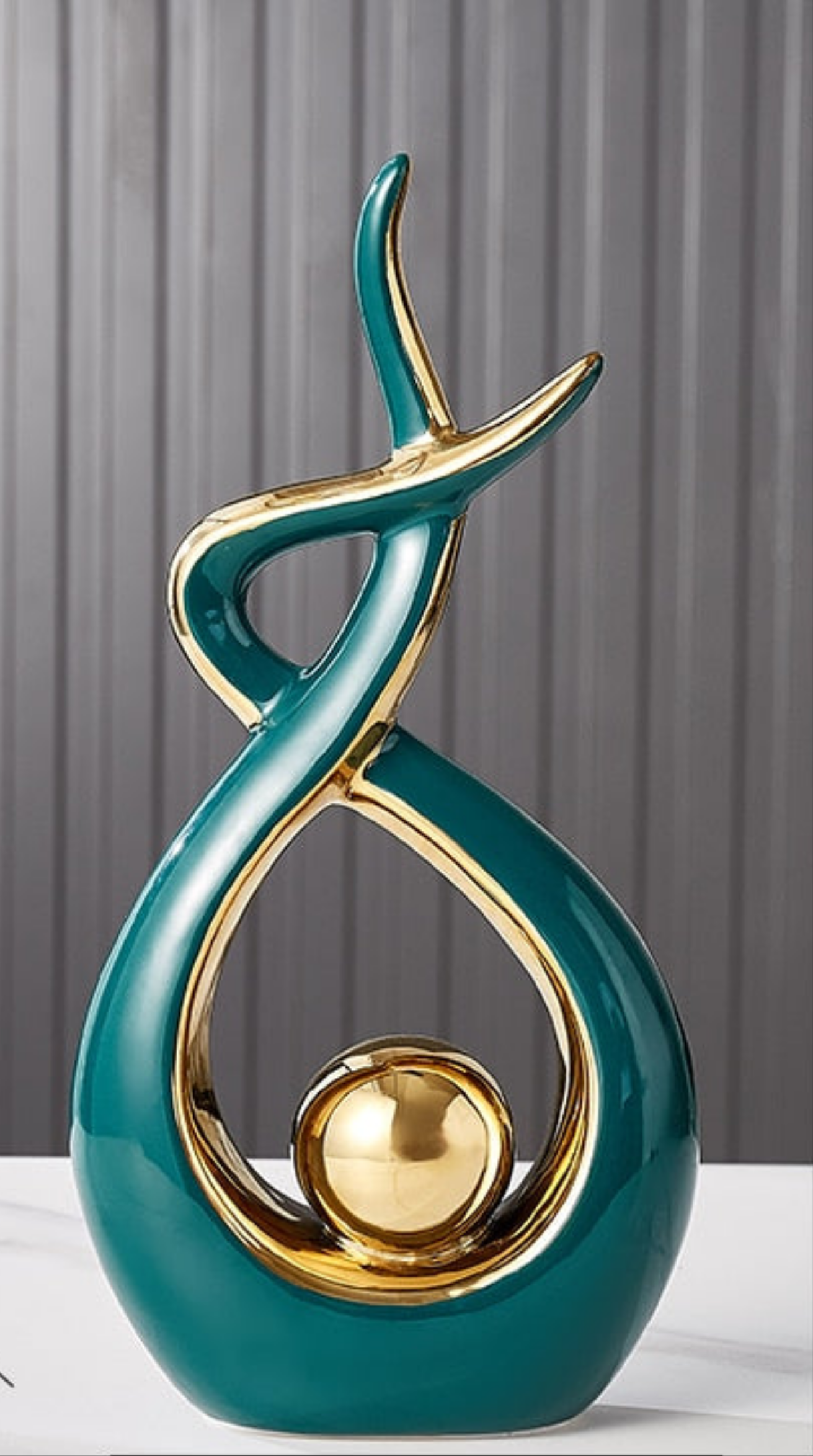 Ceramic abstract figurine with golden sphere