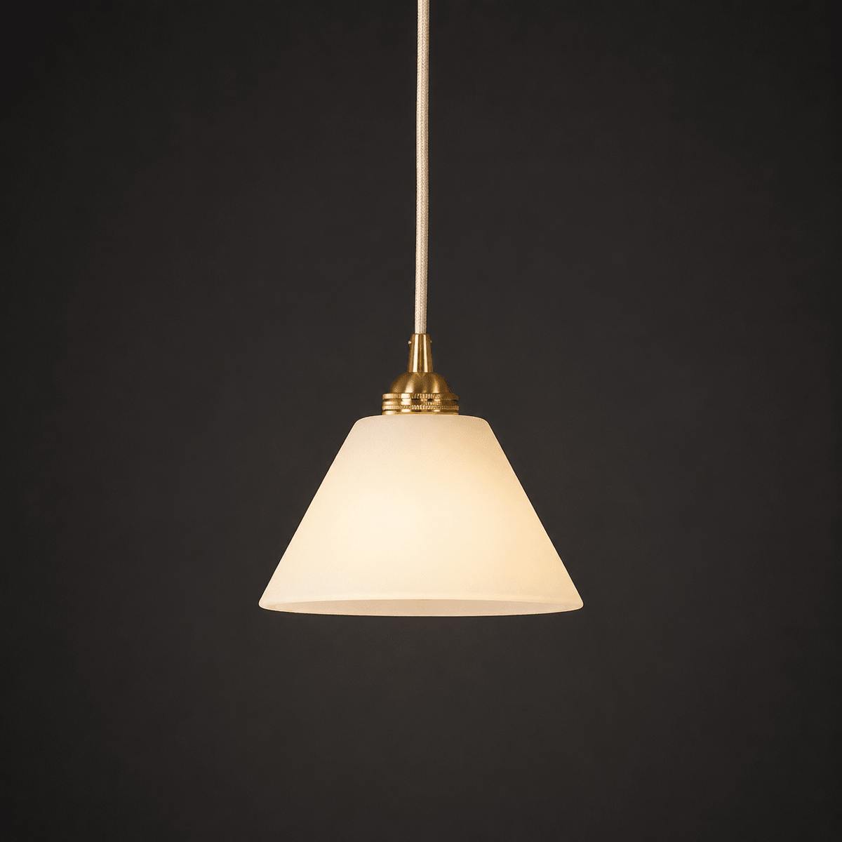 Conical pendant light for the hallway with a brass detail