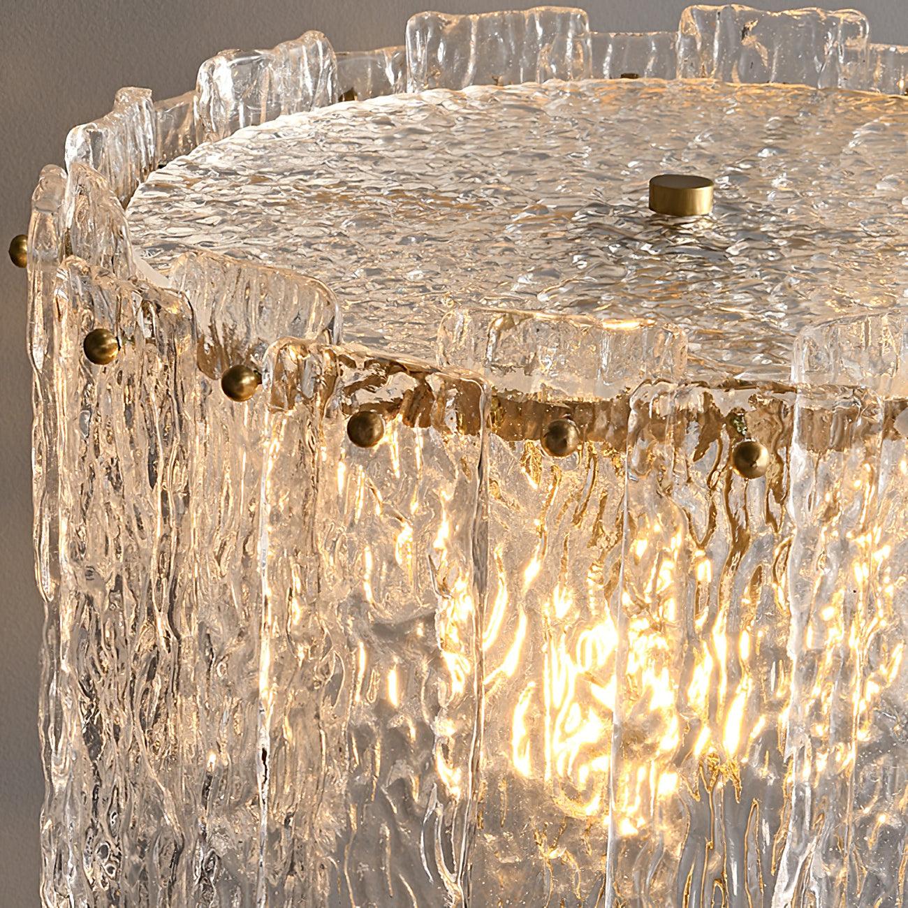 Table lamp with faceted transparent shade and round base