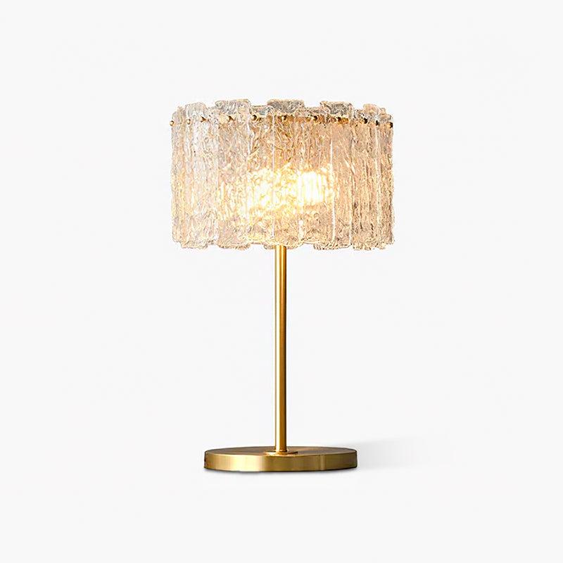 Table lamp with faceted transparent shade and round base
