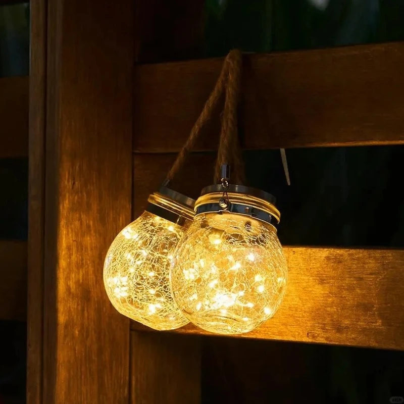 Zewnętrzna lampa wisząca z szklaną kulą i uchwytem z liny
