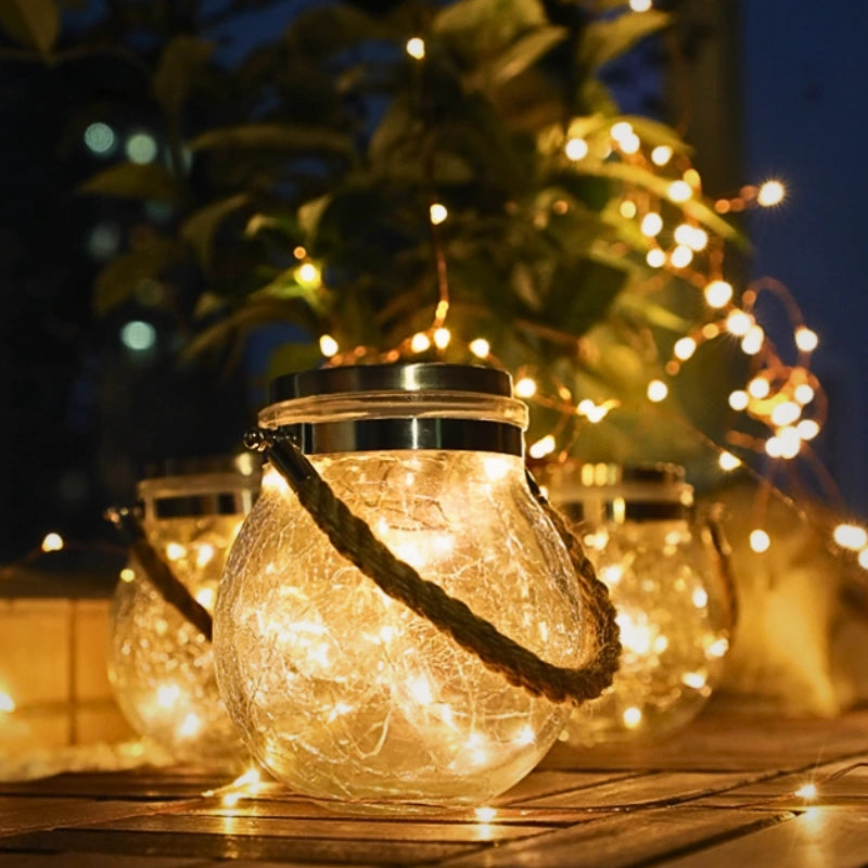 Zewnętrzna lampa wisząca z szklaną kulą i uchwytem z liny