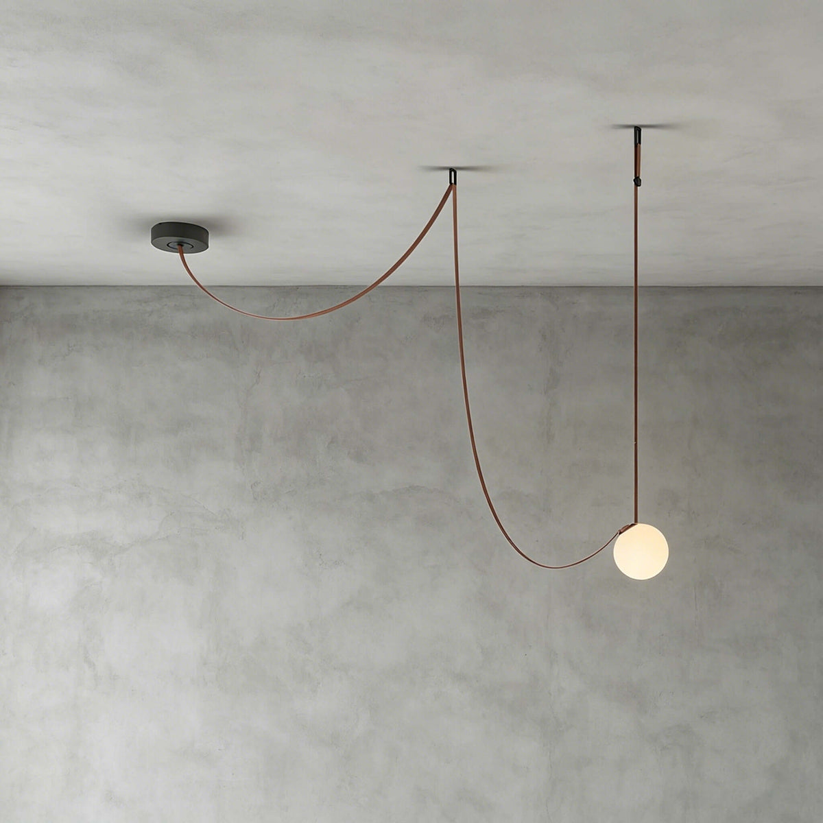 Modern ceiling light with an asymmetrical design and illuminated spheres