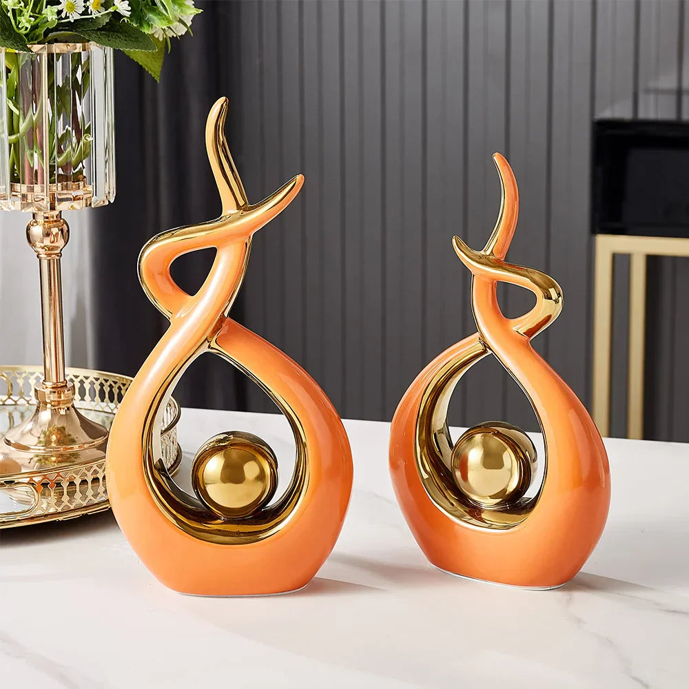 Ceramic abstract figurine with golden sphere