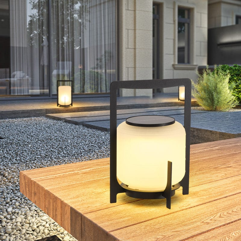 Freestanding solar outdoor lamp with enclosed light