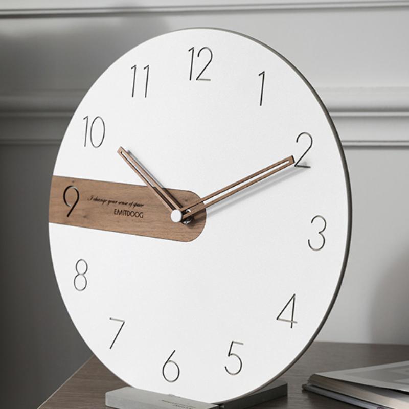 Round wall clock with white dial and wooden element