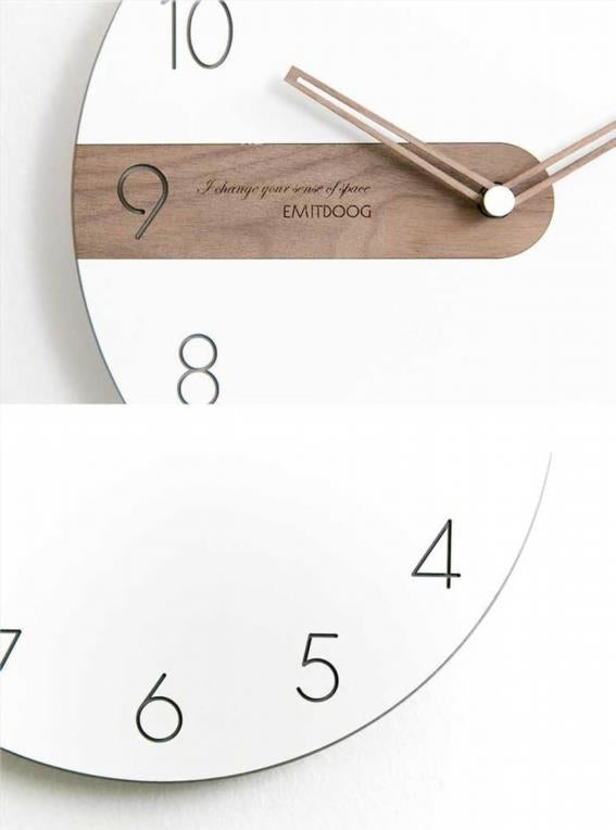 Round wall clock with white dial and wooden element