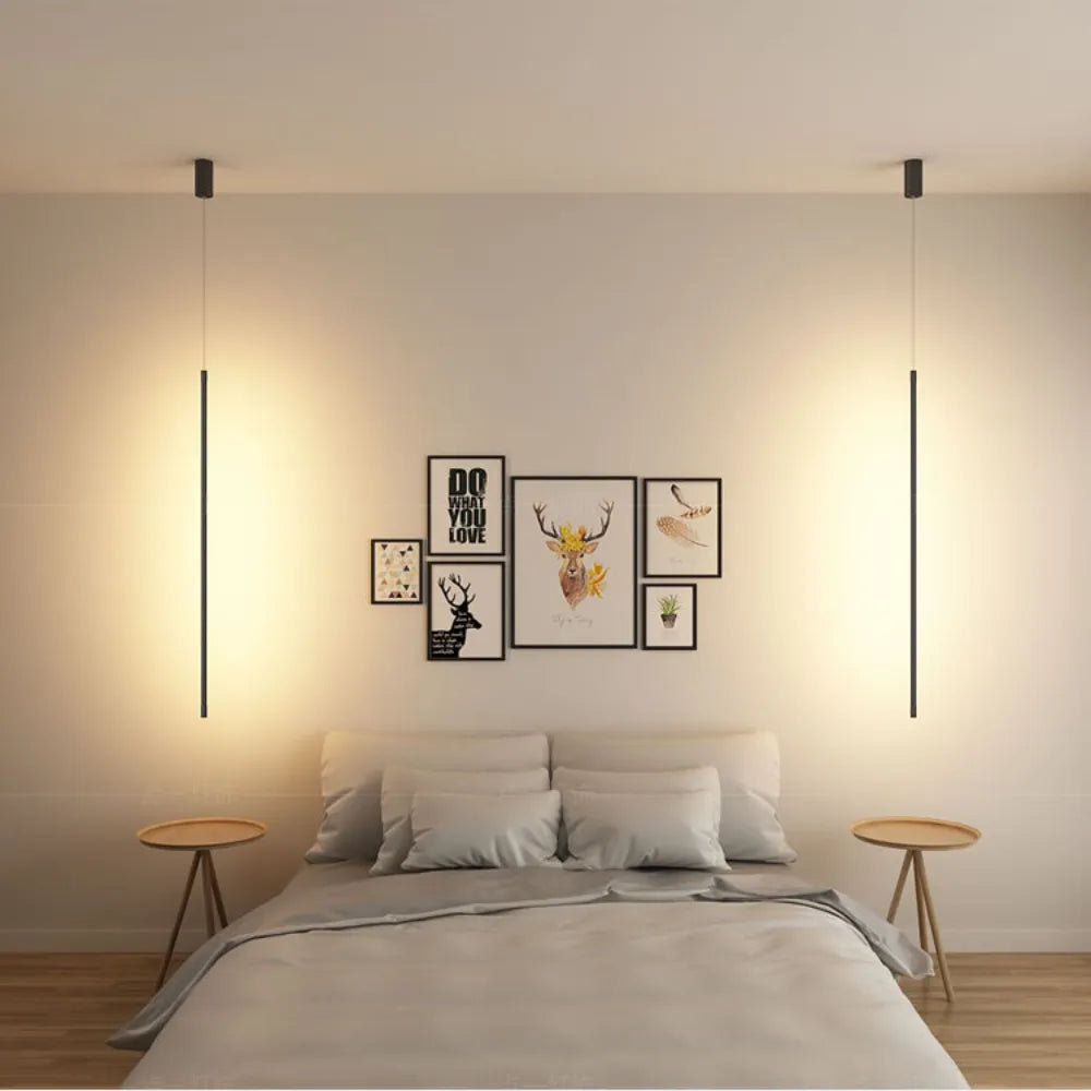 Minimalistyczna liniowa lampa wisząca LED przy łóżku