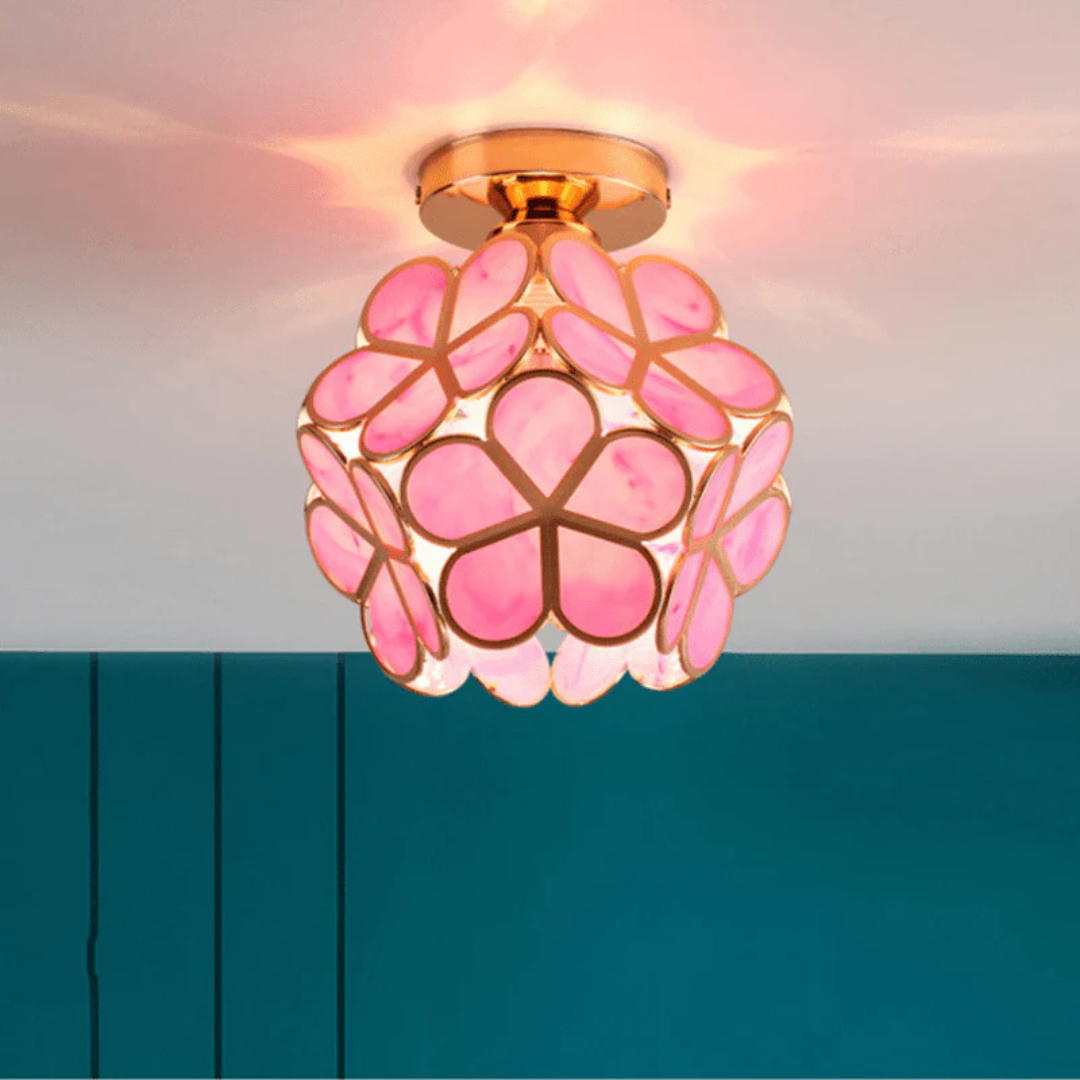 Ceiling fixture with a rounded form and petal elements