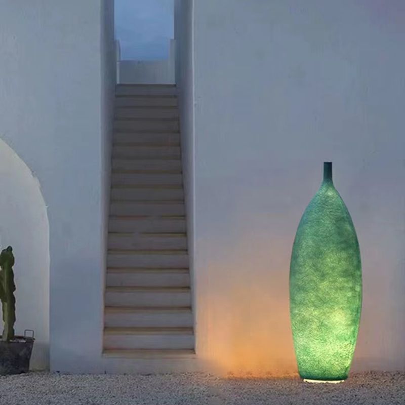 Floor lamp shaped like a bottle with textured surface