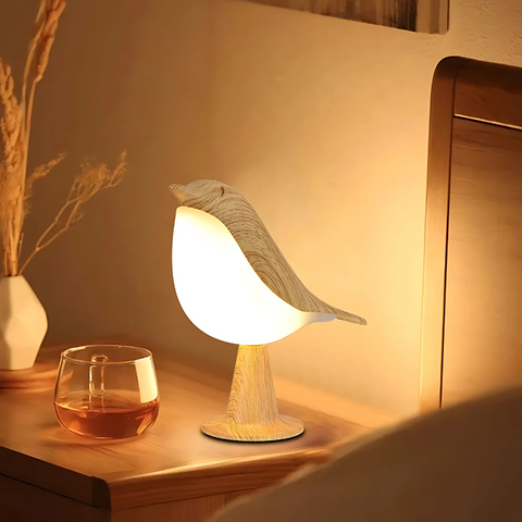 Tafellamp in vogelvorm met verlicht lichaam