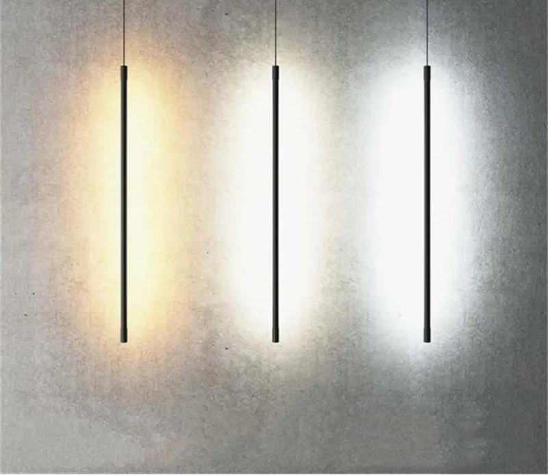 Minimalistyczna liniowa lampa wisząca LED przy łóżku