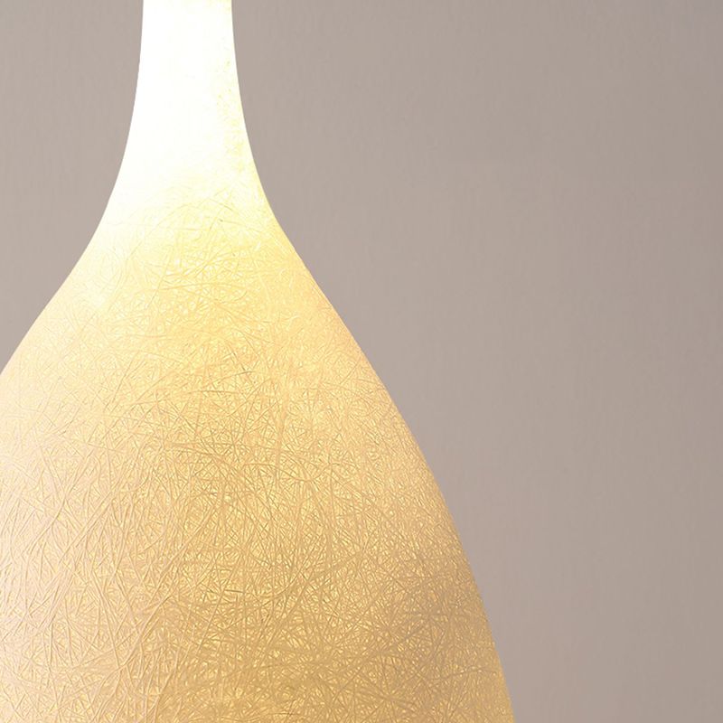 Floor lamp shaped like a bottle with textured surface