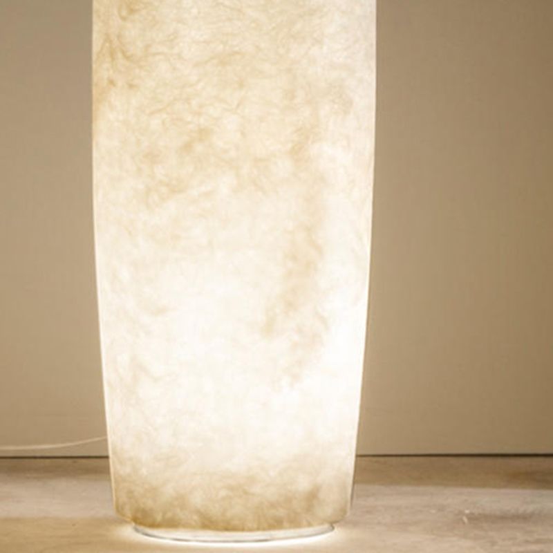 Floor lamp shaped like a bottle with textured surface