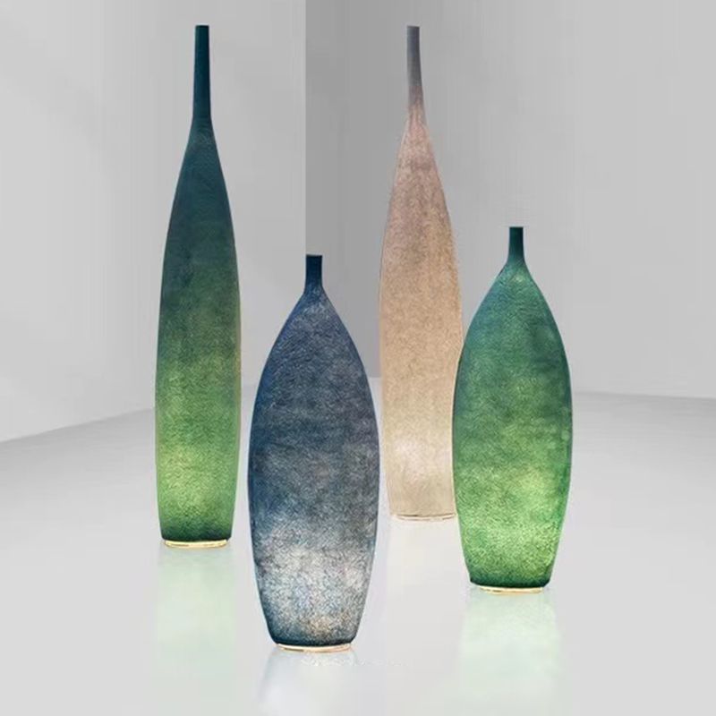 Floor lamp shaped like a bottle with textured surface