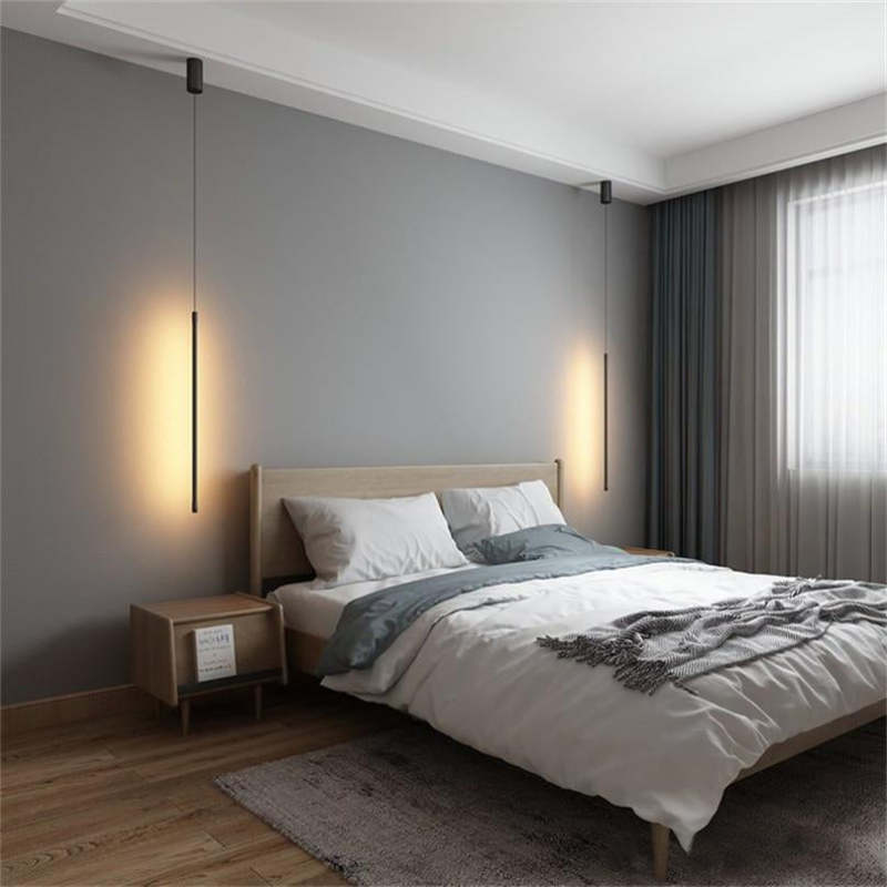 Minimalistyczna liniowa lampa wisząca LED przy łóżku