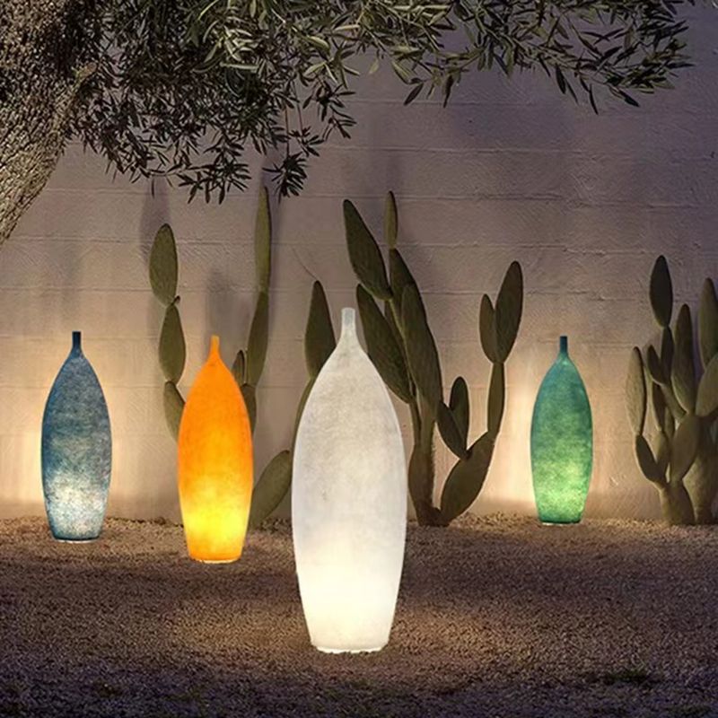 Floor lamp shaped like a bottle with textured surface