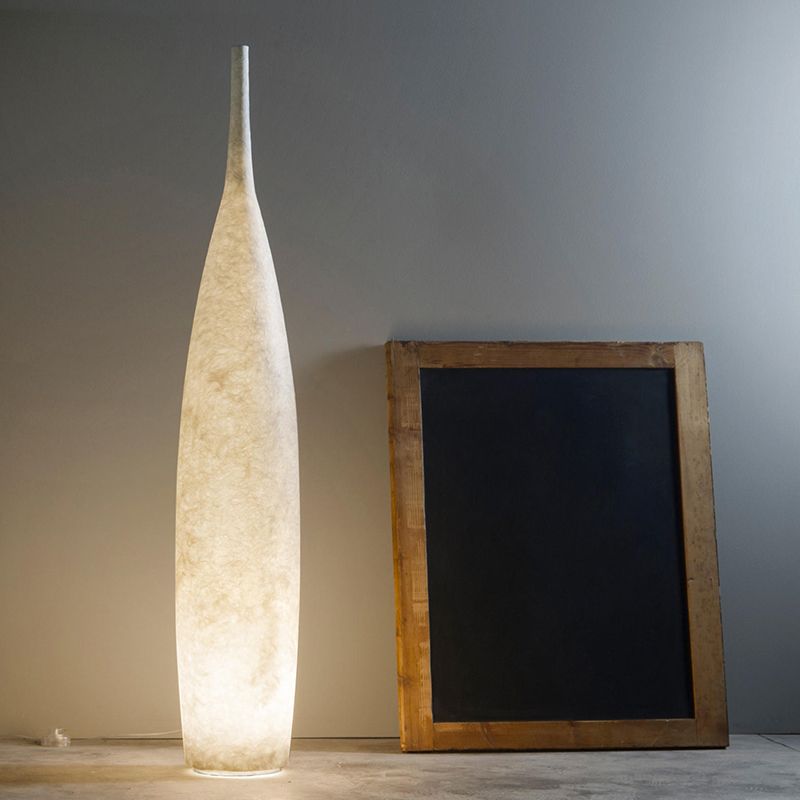 Floor lamp shaped like a bottle with textured surface