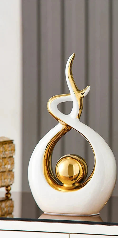 Ceramic abstract figurine with golden sphere