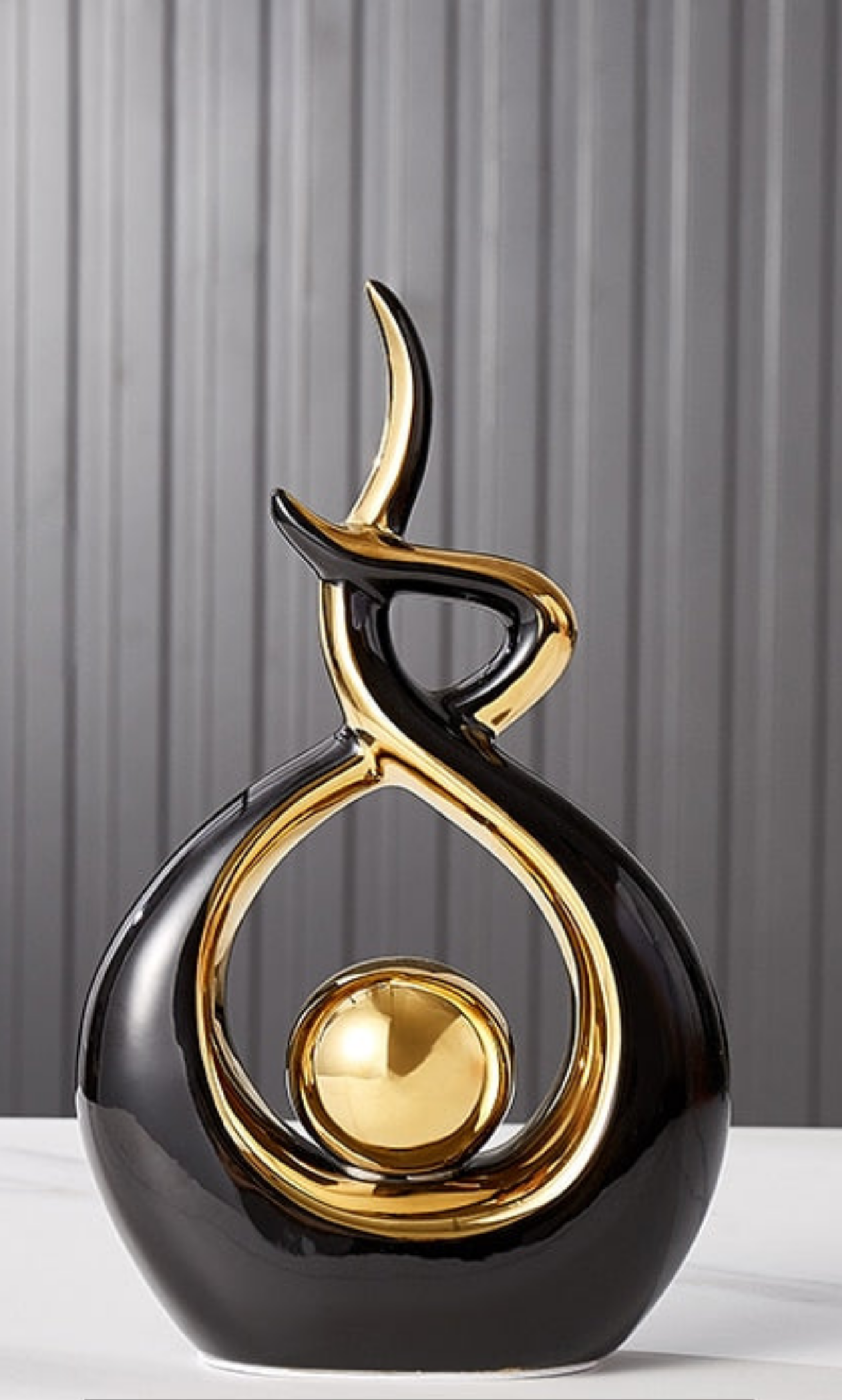 Ceramic abstract figurine with golden sphere