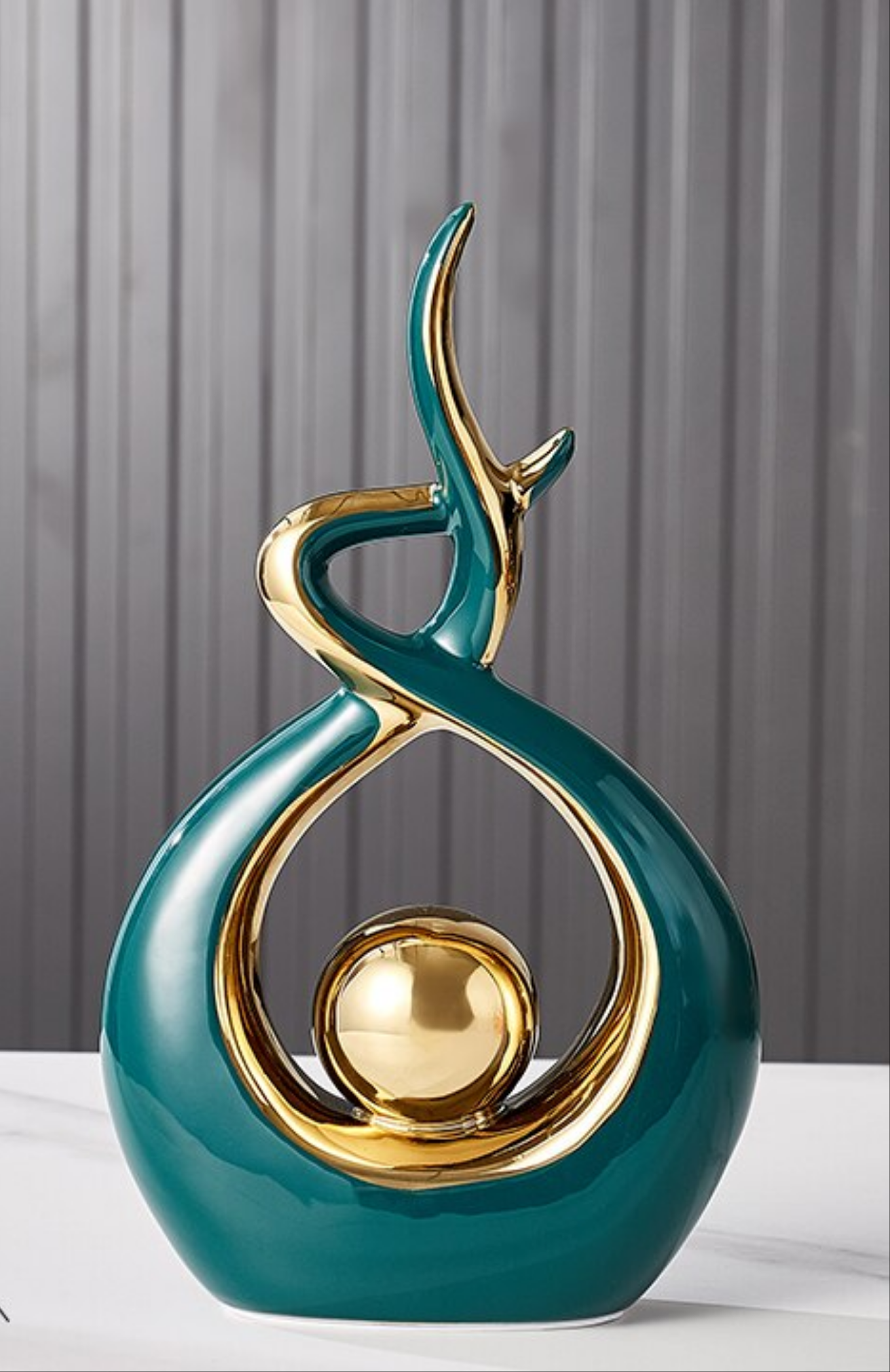Ceramic abstract figurine with golden sphere