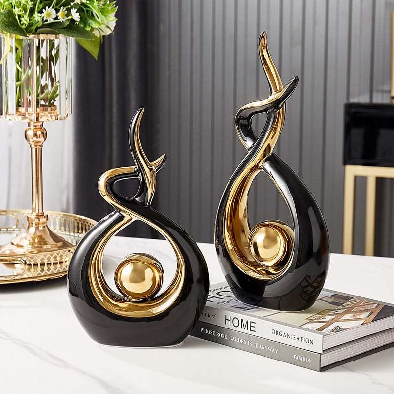 Ceramic abstract figurine with golden sphere