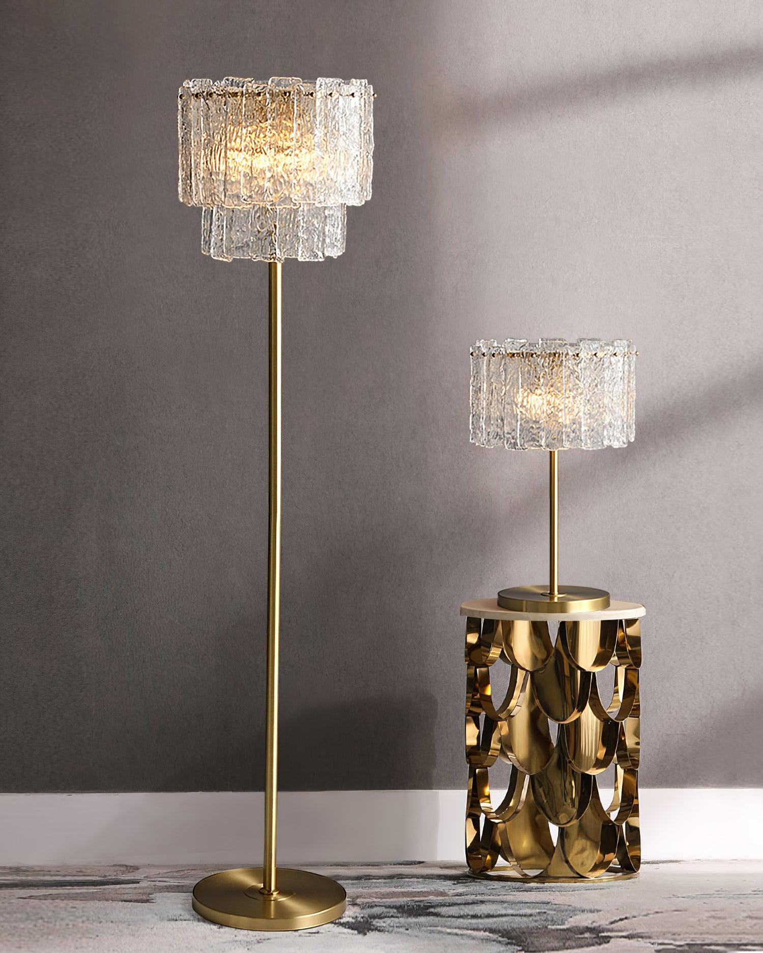 Table lamp with faceted transparent shade and round base