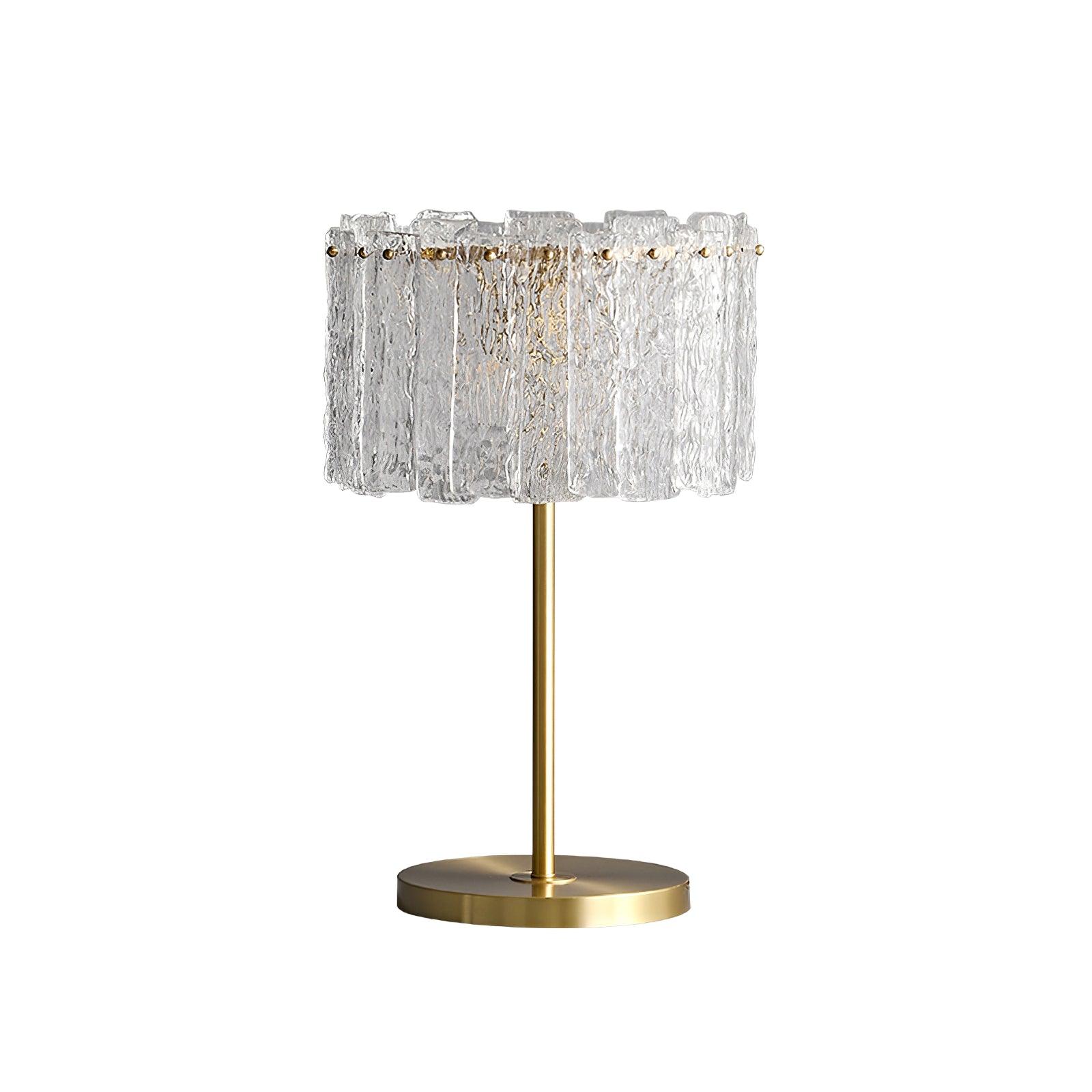 Table lamp with faceted transparent shade and round base
