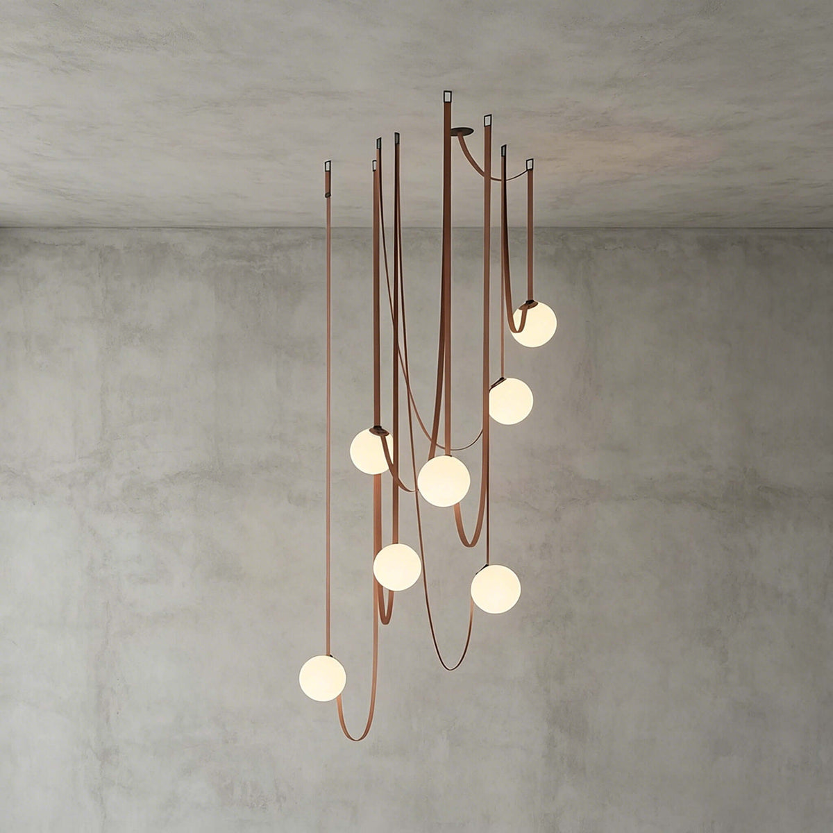 Modern ceiling light with an asymmetrical design and illuminated spheres