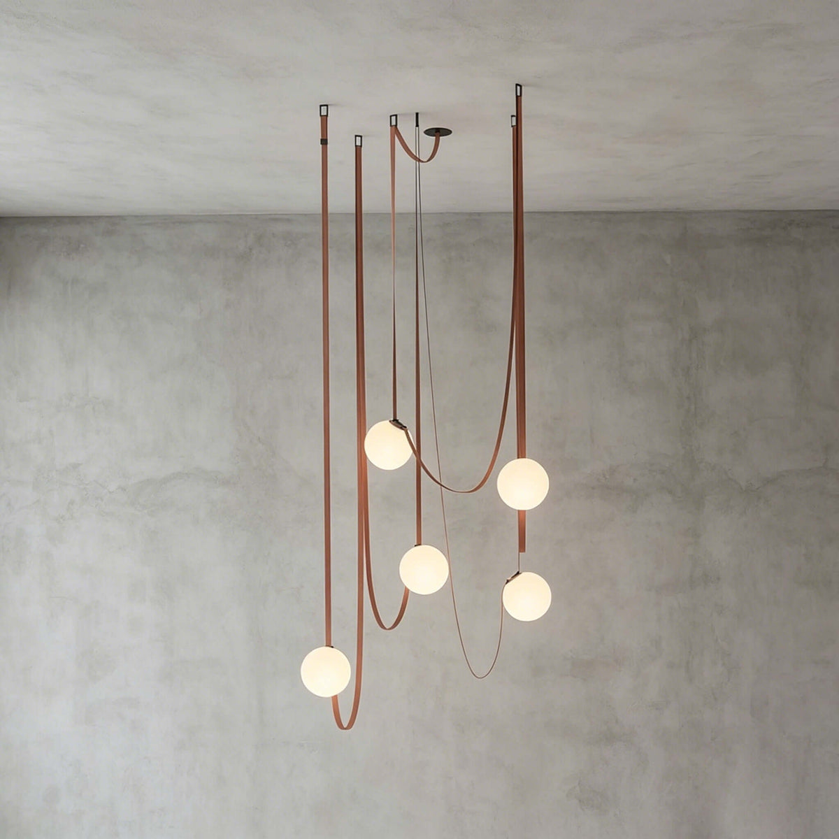 Modern ceiling light with an asymmetrical design and illuminated spheres
