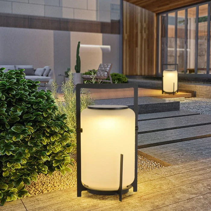 Freestanding solar outdoor lamp with enclosed light
