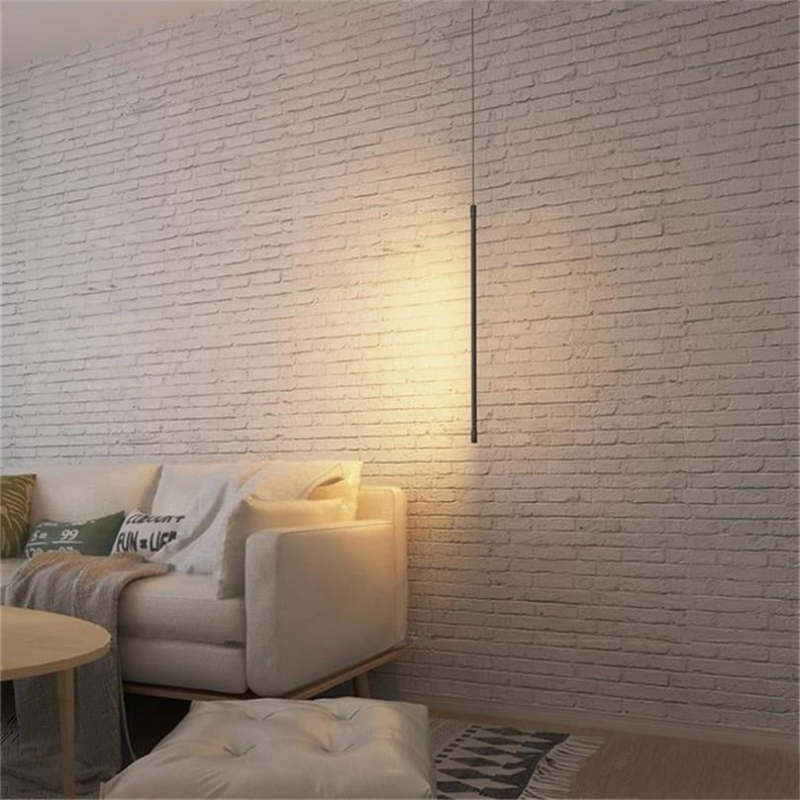 Minimalistyczna liniowa lampa wisząca LED przy łóżku