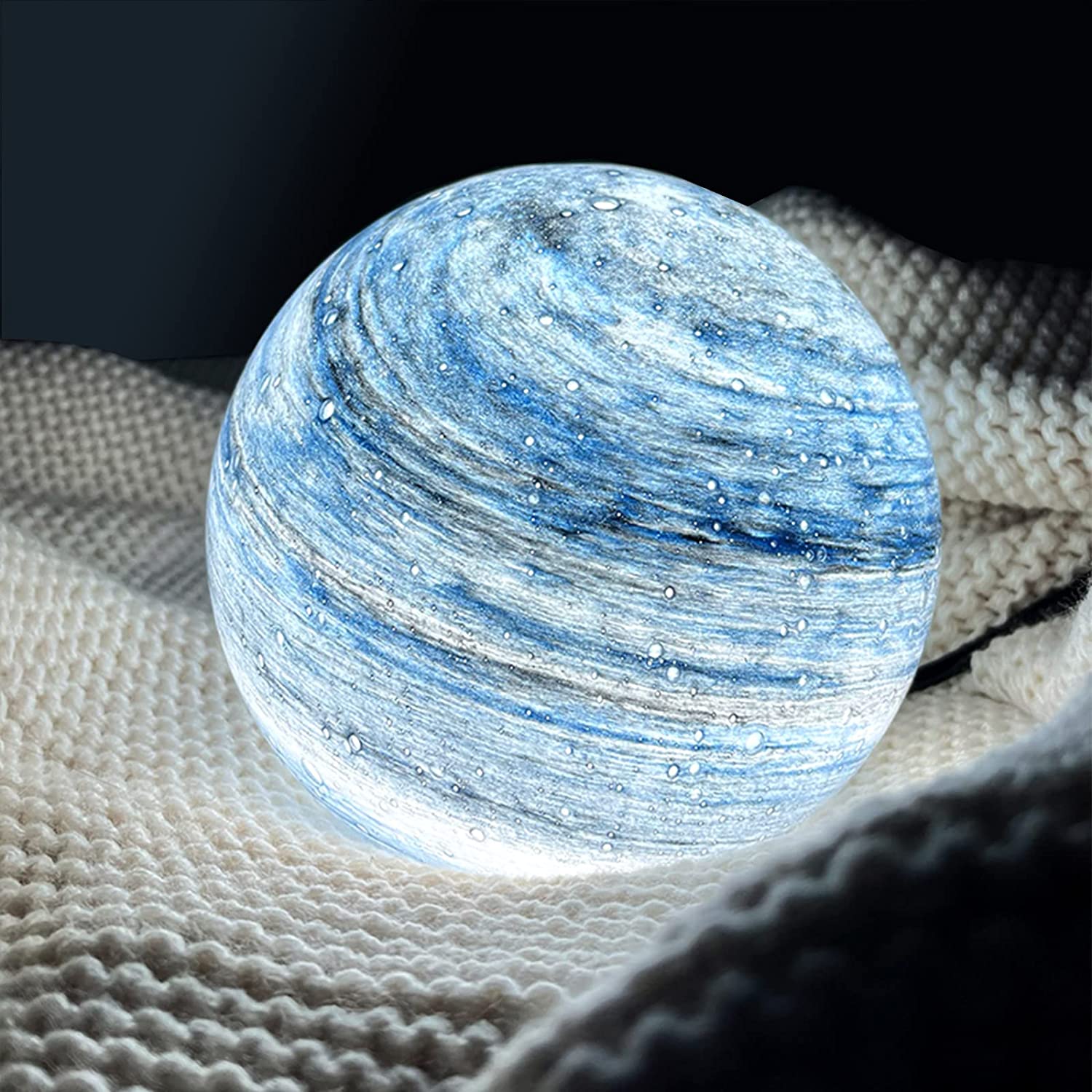 Glass LED table lamp inspired by the moon with cosmic pattern
