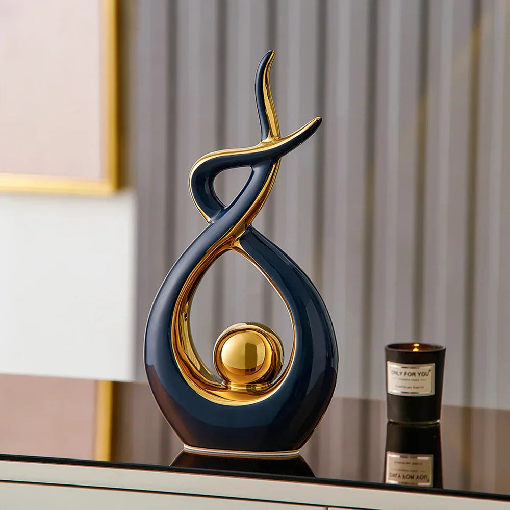 Ceramic abstract figurine with golden sphere